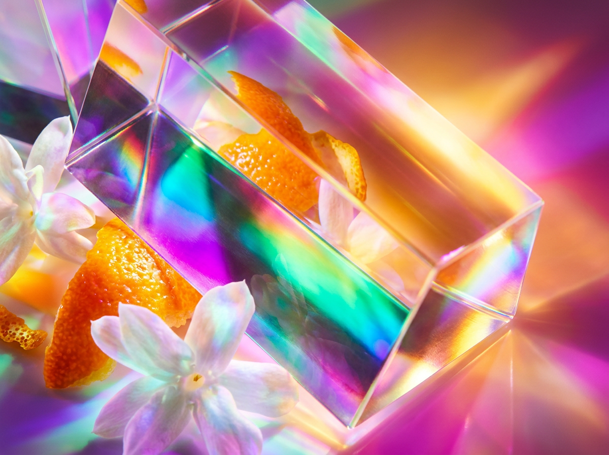 Fresh botanical ingredients and perfume bottles